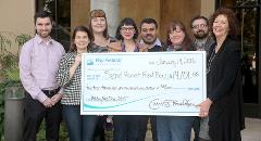 Bay Federal Credit Union's Community Support Committee presents a check to Second Harvest Food Bank's Jan Kamman, at right, on January 14, 2016.