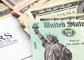 A close up of money and a treasury check