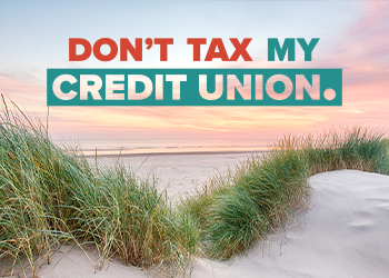 A beach with the words "Don't tax my credit union"