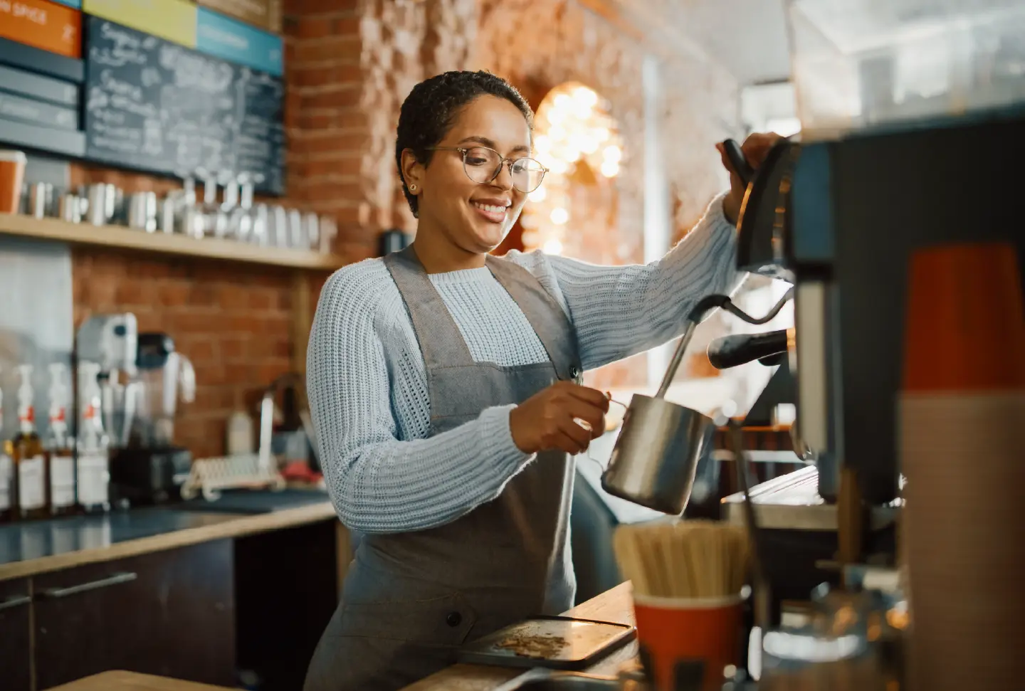 Woman working and making coffee