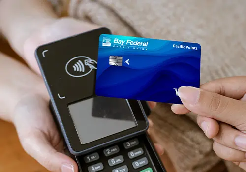Someone using their Pacific Points card to pay
