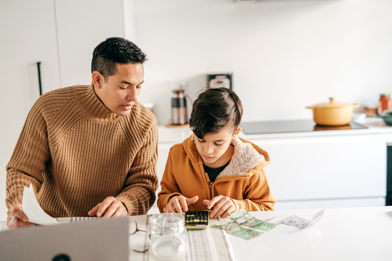 Father and son counting money 