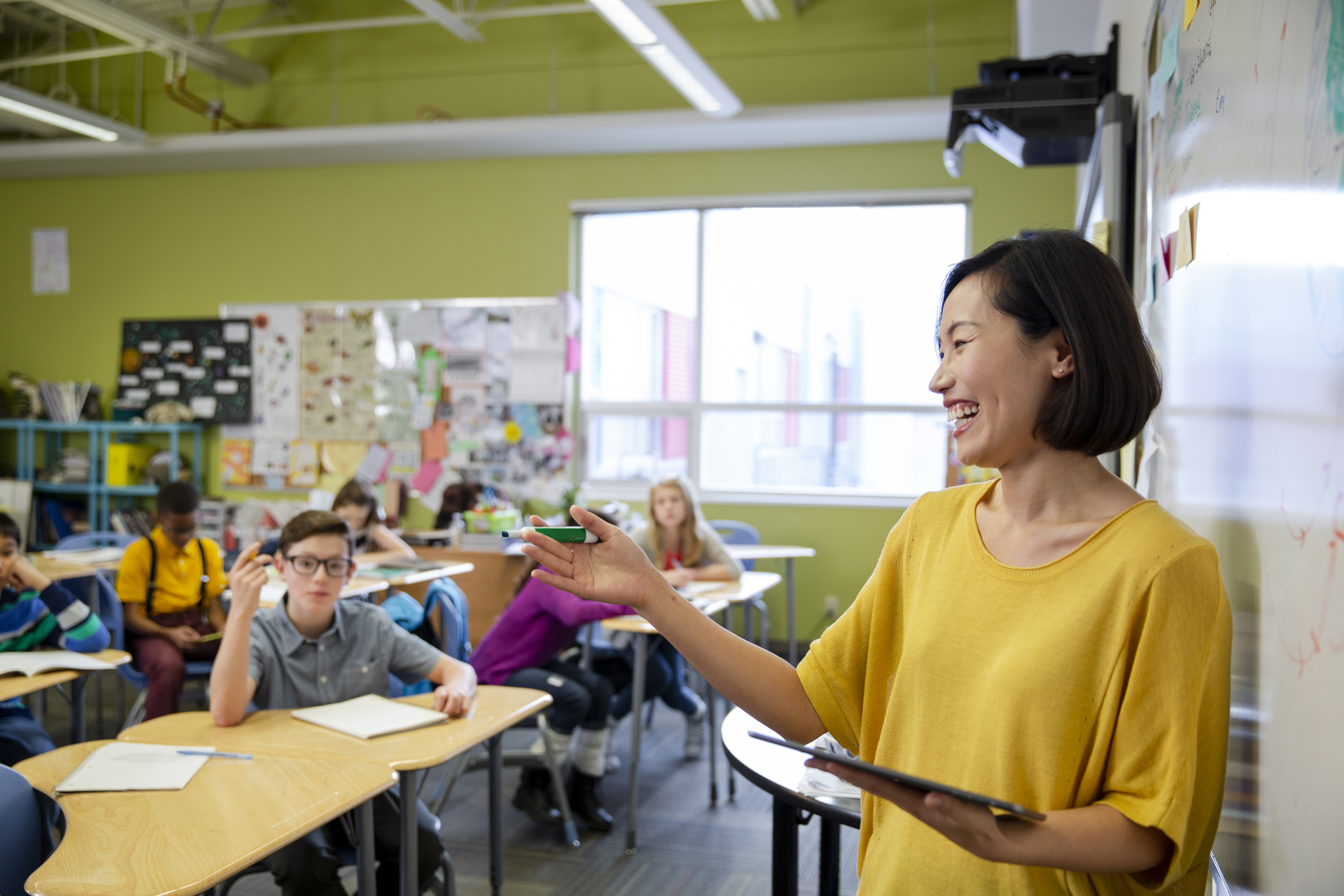 Teacher in front of class of students