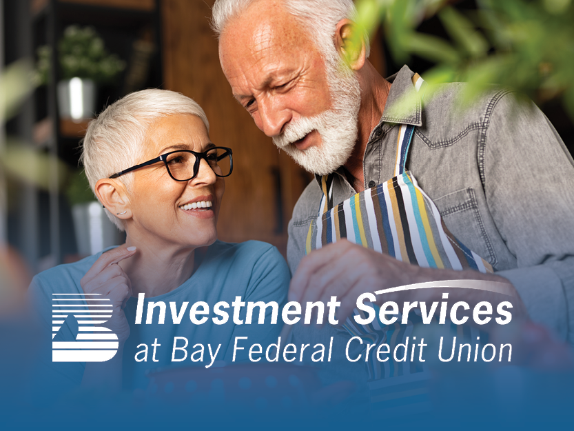 Man and a woman cooking together with the Investment Services logo in the foreground