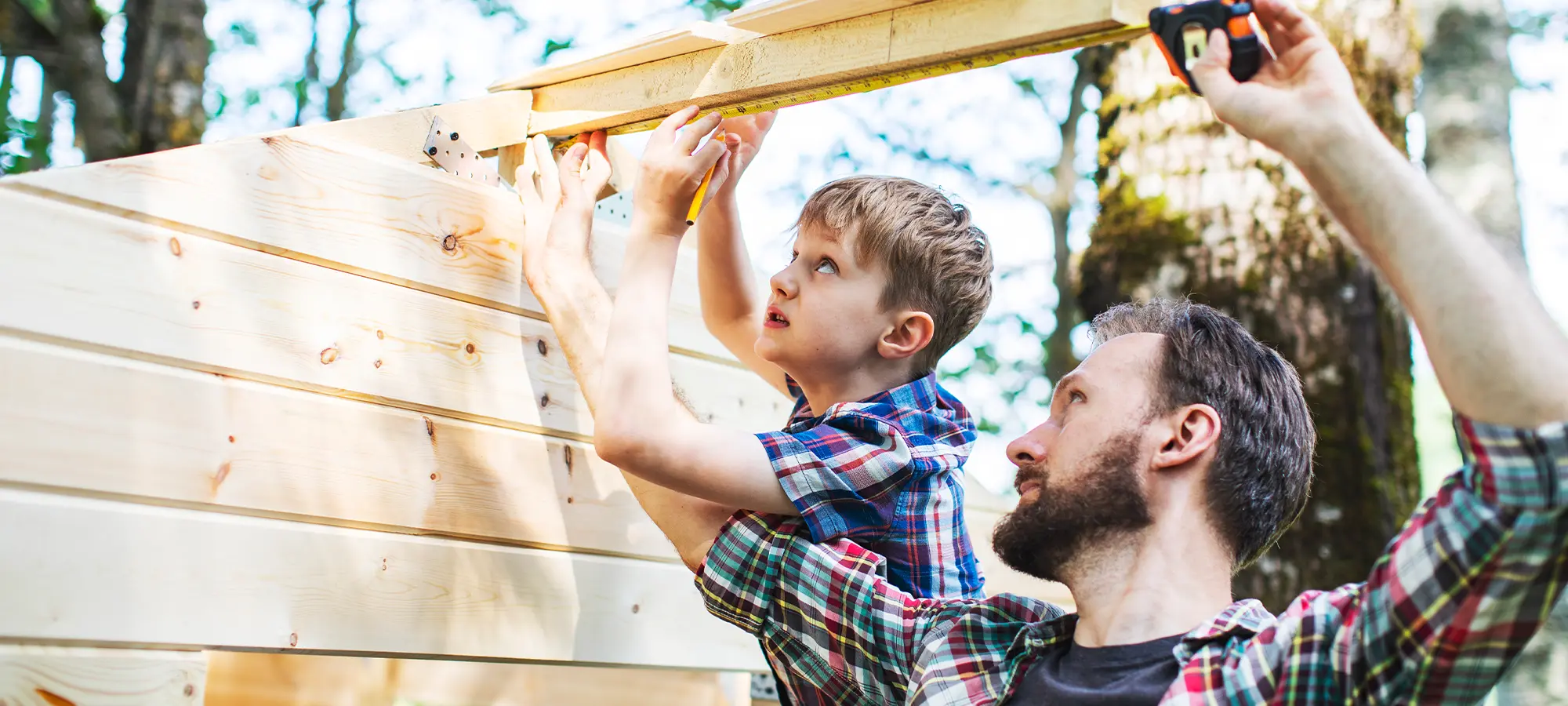 Father and son working on home construction