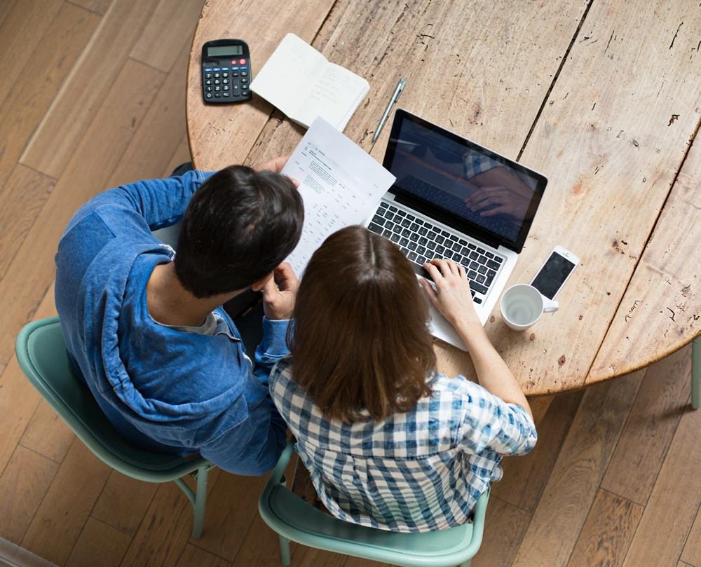 Two people looking at paperwork